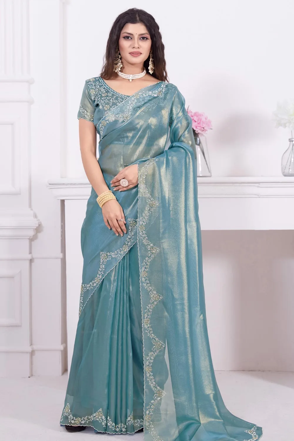 Fancy Teal Saree with Raina Net Coating Fabric and Dual-Colored Zircon Border